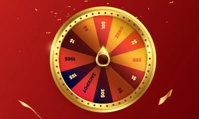 A spinning wheel of fortune with cash prizes and a "lose" section.